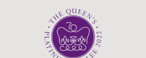 The Queen's Platinum Jubilee Emblem - The emblem features a purple and platinum design. The continuous platinum line reveals a stylised St Edward’s Crown, incorporating the number 70, on a round purple background associated with royalty and signifying a royal seal. The elegant font Perpetua, meaning forever, is an acknowledgement to the first British Monarch ever to mark 70 years on the throne.