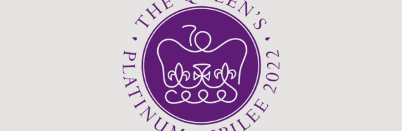 The Queen's Platinum Jubilee Emblem - The emblem features a purple and platinum design. The continuous platinum line reveals a stylised St Edward’s Crown, incorporating the number 70, on a round purple background associated with royalty and signifying a royal seal. The elegant font Perpetua, meaning forever, is an acknowledgement to the first British Monarch ever to mark 70 years on the throne.