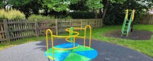 Brighton green and blue coloured children's play area roundabout
