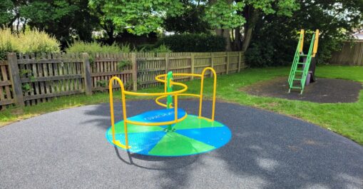 Brighton green and blue coloured children's play area roundabout